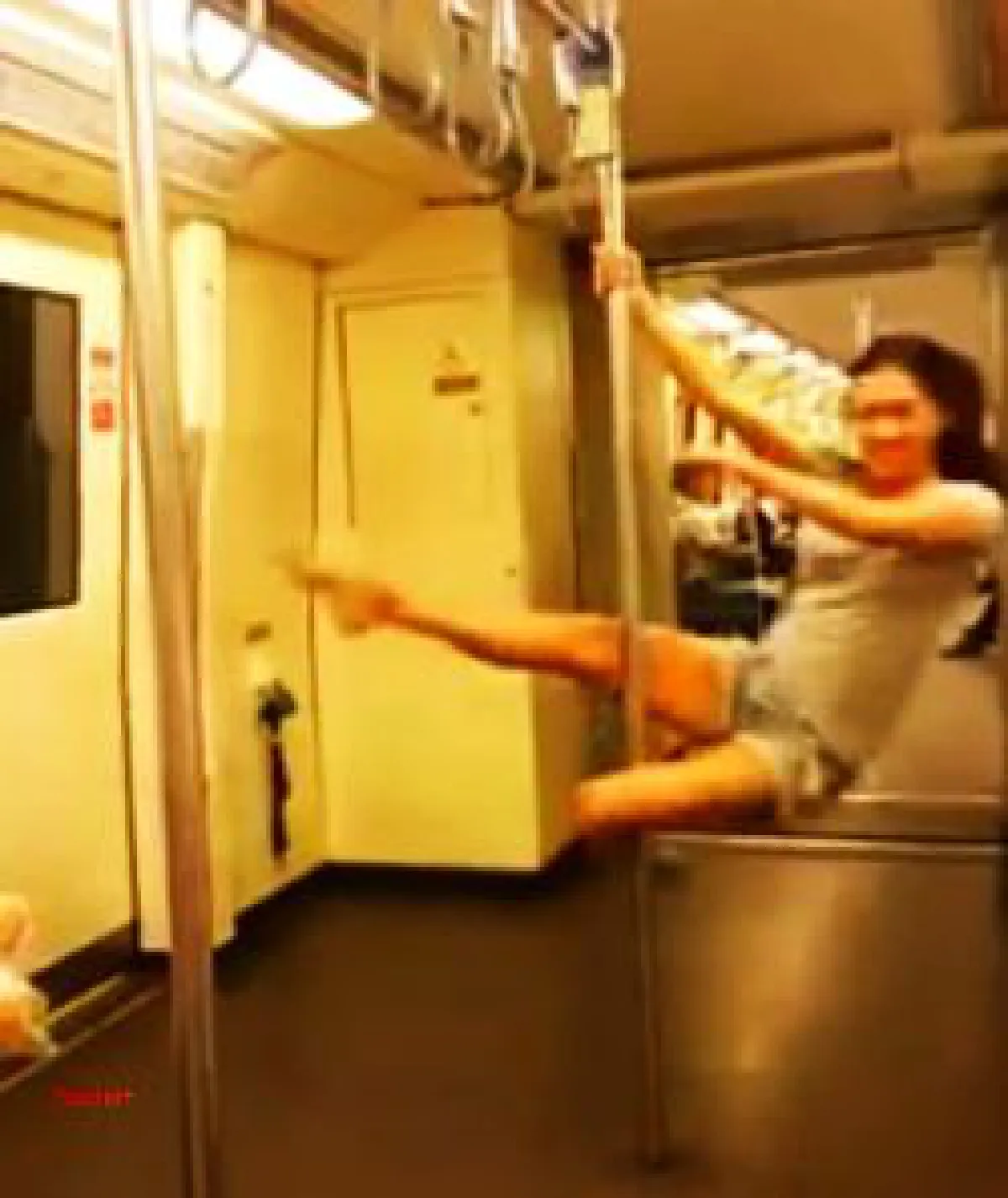Pole dancing on Bangkok subway: Don't try it