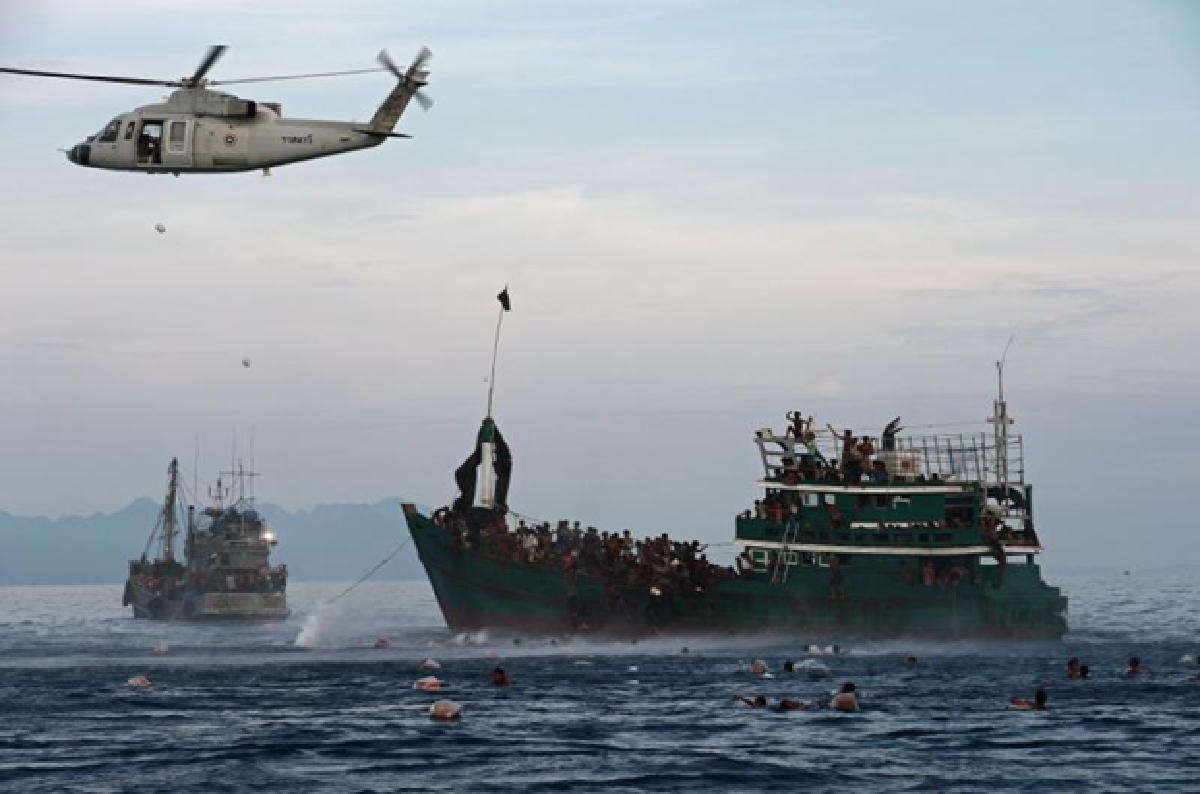 Navy pushes migrants out to sea; others rescued (UPDATED)