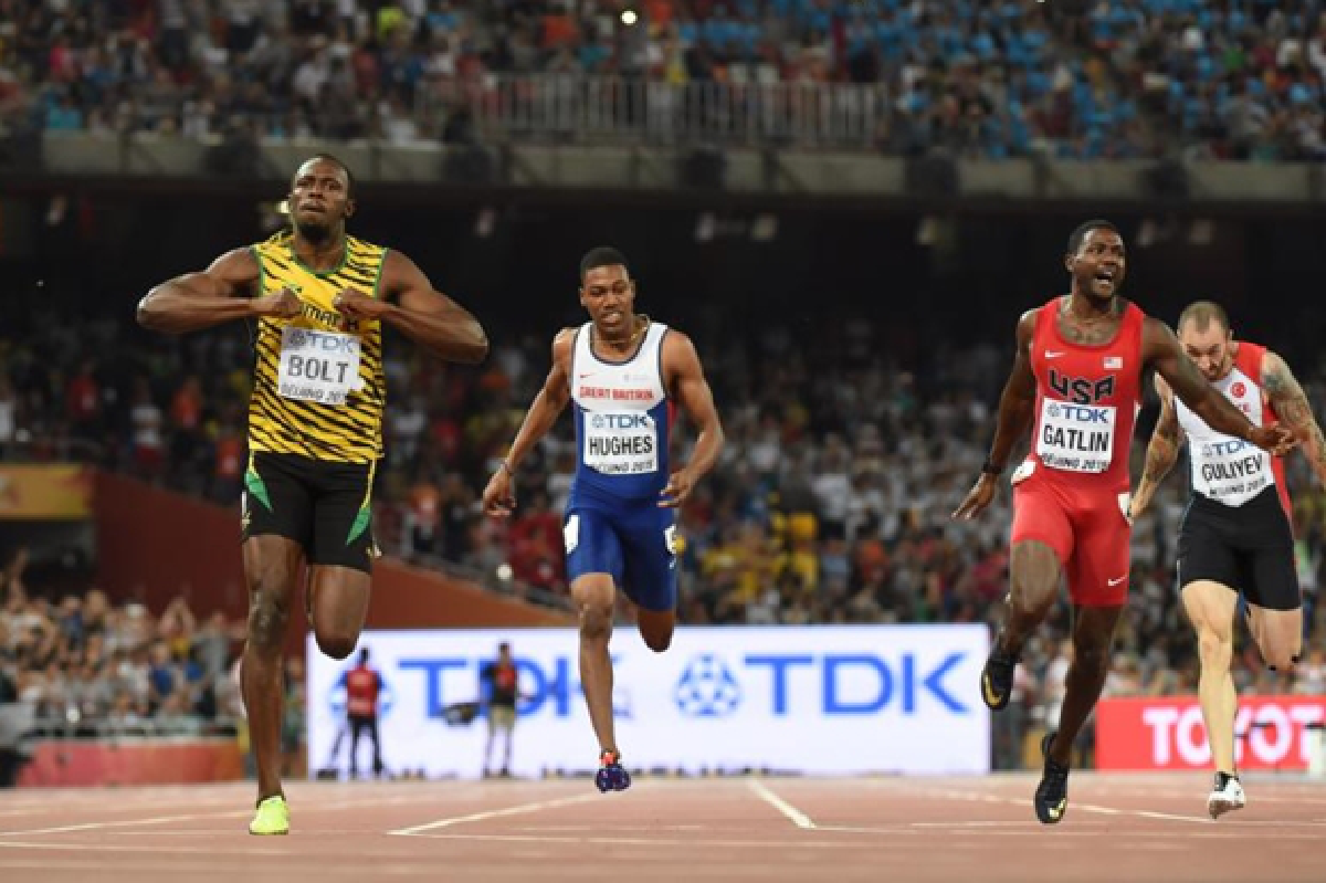 Bolt wins easily, then loses to cameraman