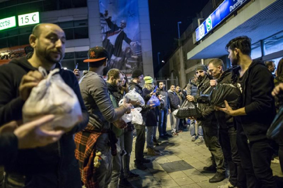 Warm welcome for refugees in Germany, but thousands still stranded.