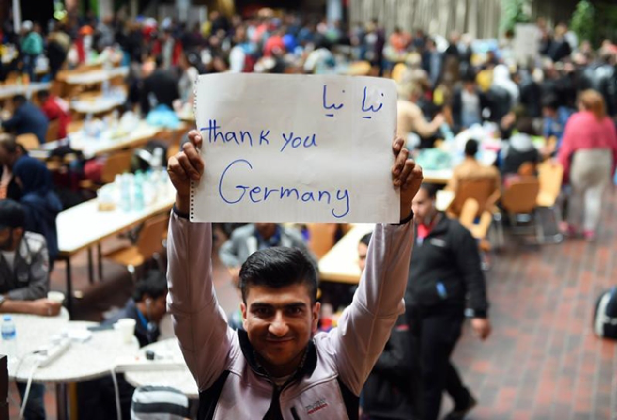 Warm welcome for refugees in Germany, but thousands still stranded.
