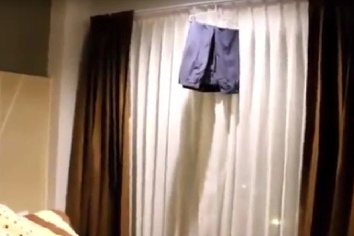 แจ้งตำรวจเห็นเงาคนผูกคอตายในคอนโด ที่แท้เป็นเพียงกางเกงขาสั้นเเขวนอยู่(คลิป)