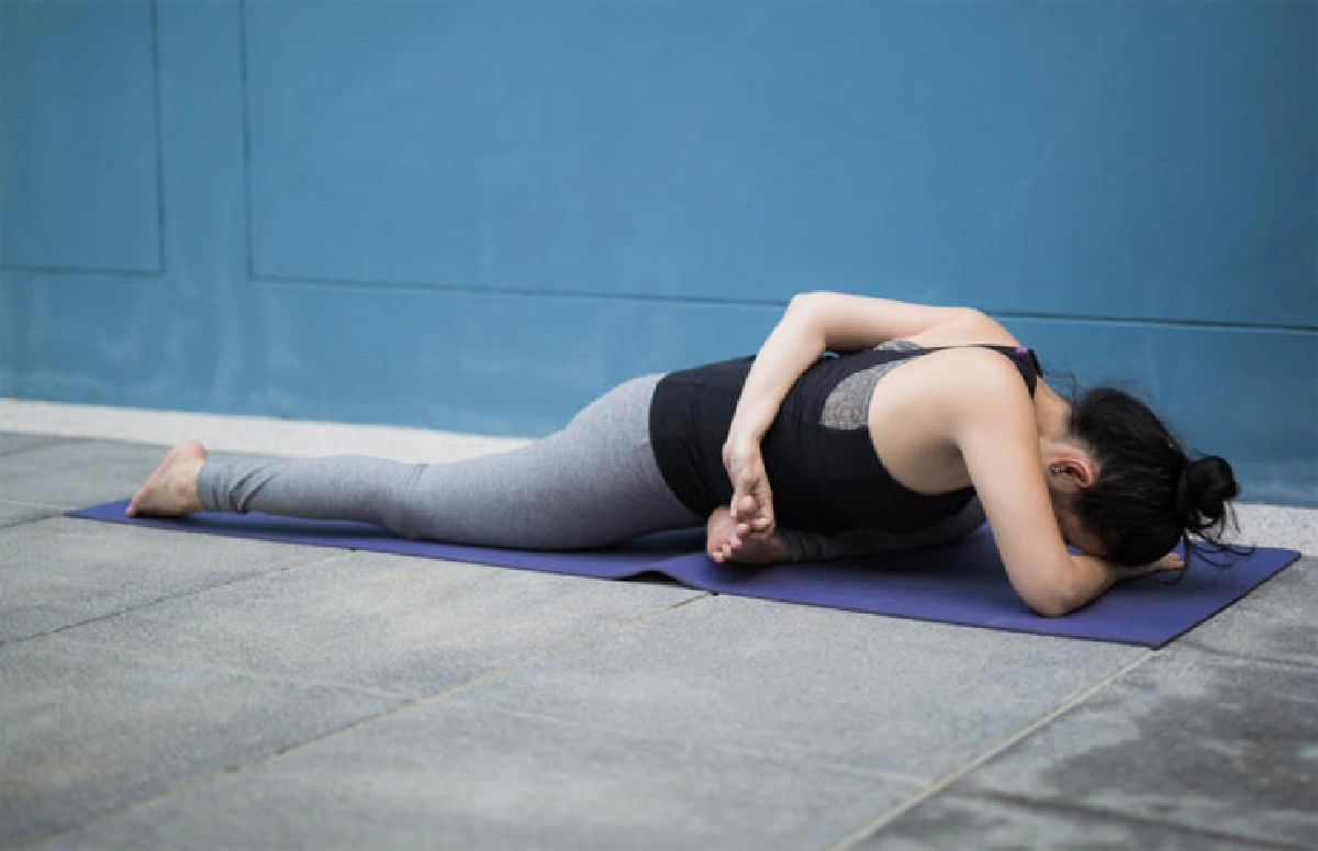 Pigeon with shoulder opener (Eka Pada Kapotasana variation)