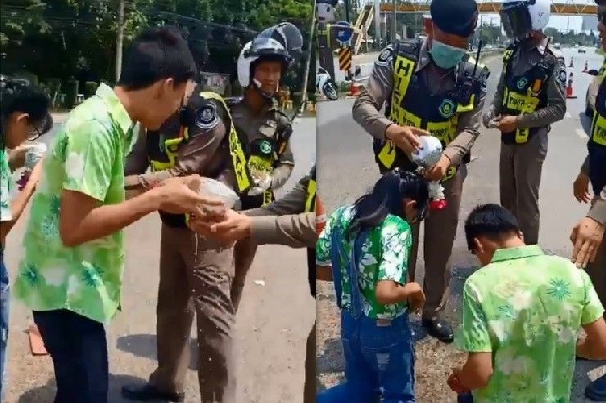 สุดซึ้ง! ลูกตำรวจปรี่รดน้ำพ่อขณะปฎิบัติหน้าที่ สุดซึ้ง! ลูกตำรวจปรี่รดน้ำพ่อขณะปฎิบัติหน้าที่